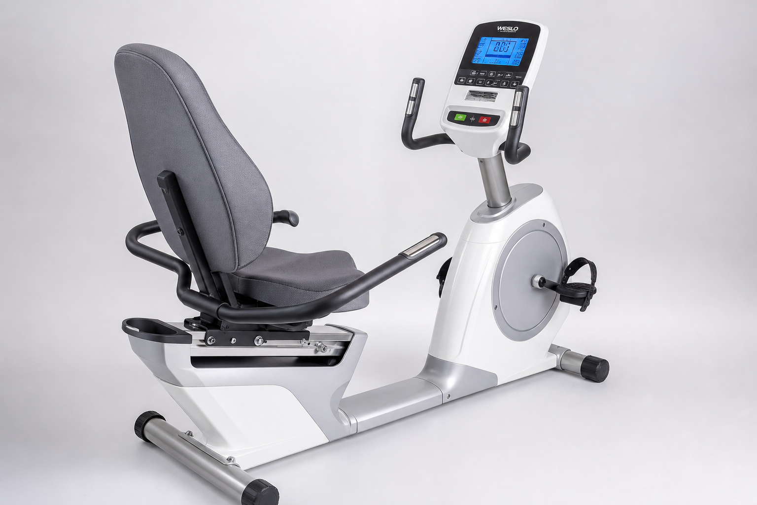 Close-up view of recumbent exercise bike highlighting senior-friendly features like padded seat, low step-through frame, and easy-to-read display