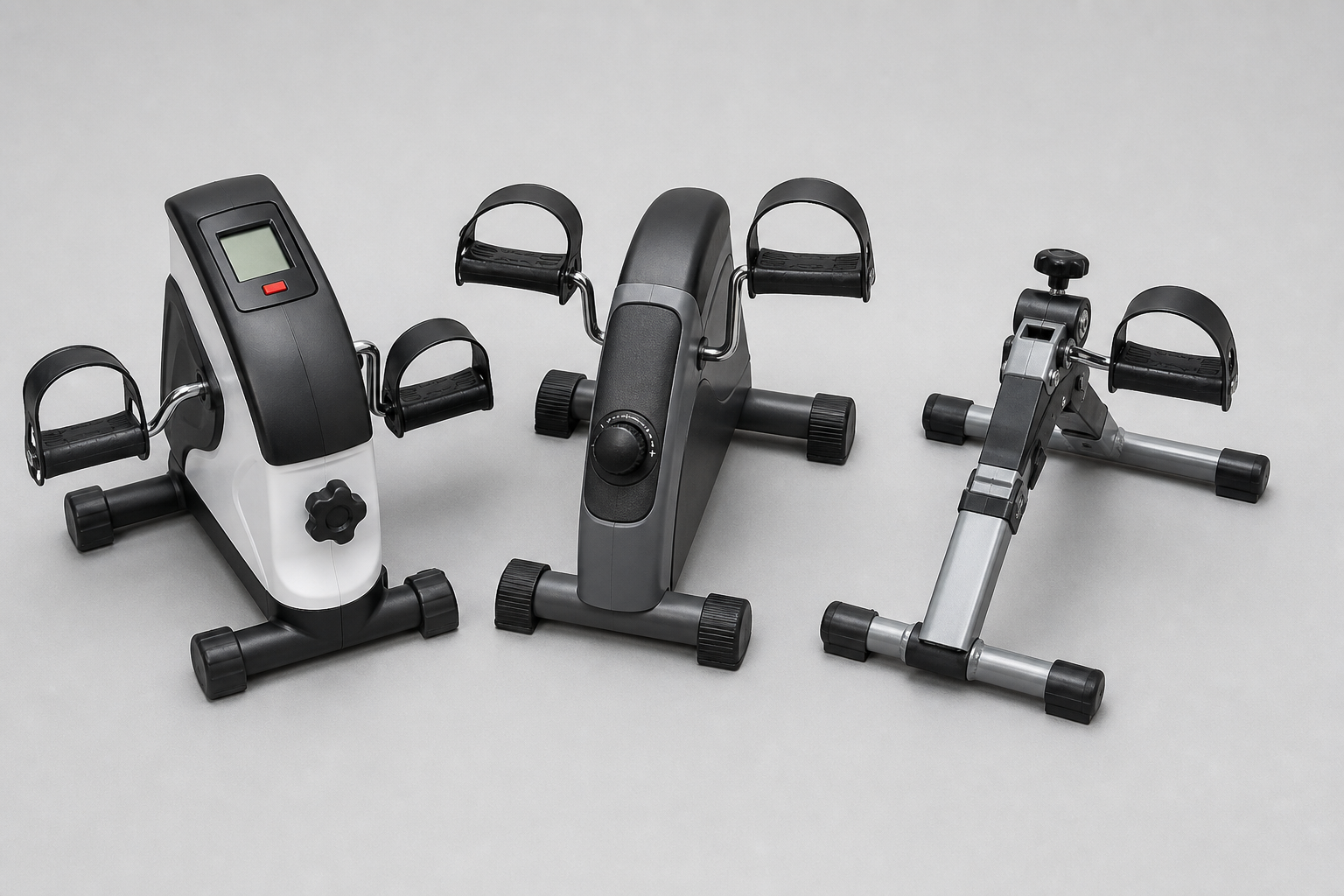 Three different pedal exerciser models displayed side by side on a clean surface