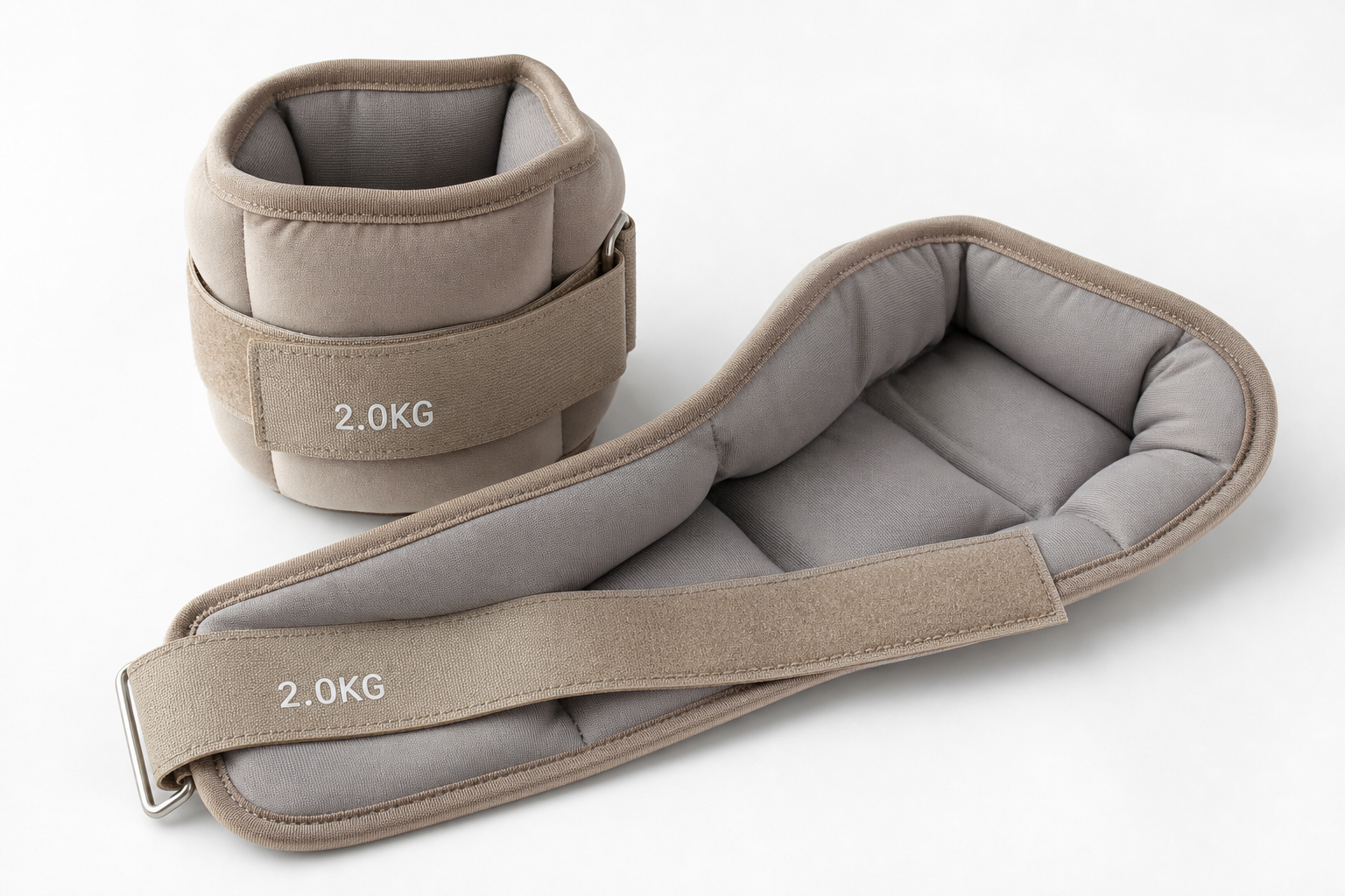Close-up of padded ankle weights with velcro straps displayed on a white surface
